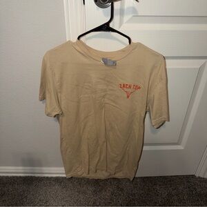 Next Level Apparel Beige Tee with Small Orange 'Zach Top' Graphic